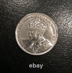 Canadian Silver Dollars 1935-1957. 8 coins in total in Vintage Collector Sleeve
