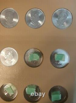 Lot of 31 1988-2020 $5 1 oz Canadian Silver Maple Leaf Coins withDansco album